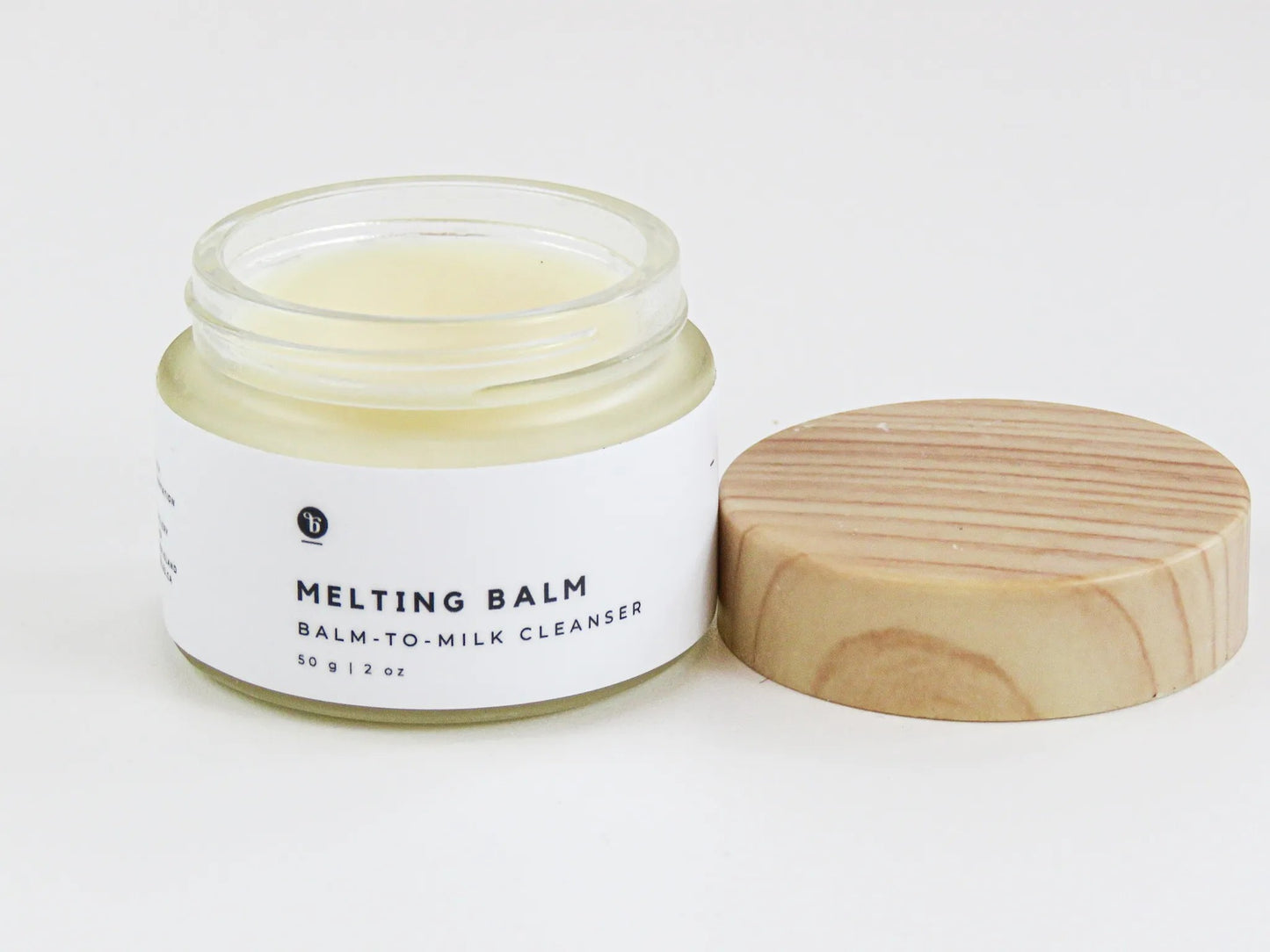 Bubble Gallery Melting Balm balm-to-milk cleanser in a glass jar with a wooden lid. For all skin types.