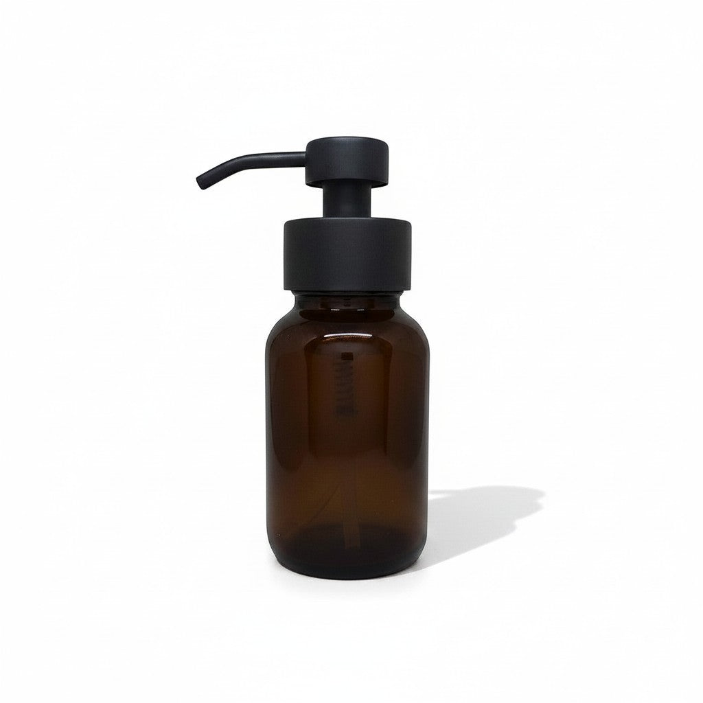Bubble Gallery amber glass foaming soap dispenser with black metal pump, 250 mL, refillable and reusable.