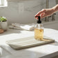 Bubble Gallery diatomaceous earth bottle tray with subtle channels for airflow. Neutral tone, absorbent surface.