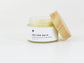 Bubble Gallery Melting Balm cleanser in a glass jar with a wooden lid, for all skin types.