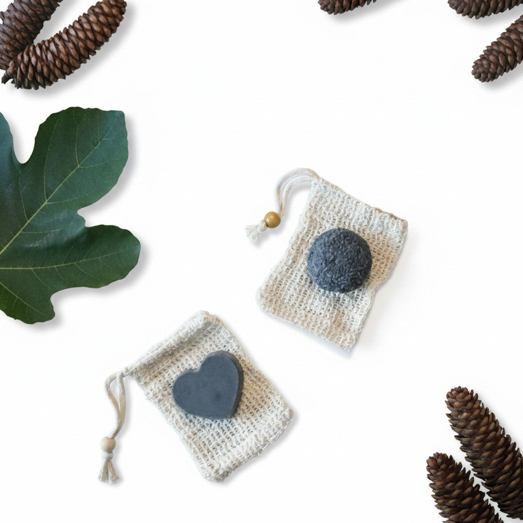 Bubble Gallery rebalancing shampoo and conditioner bar set with round and heart-shaped bars in small cotton bags.